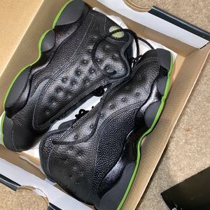 black and green Jordan 13s